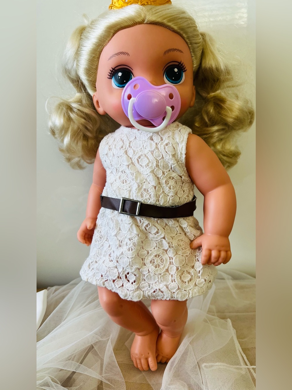 Blonde Baby Doll with Purple Pacifier and Cream Lace Dress
About 14”